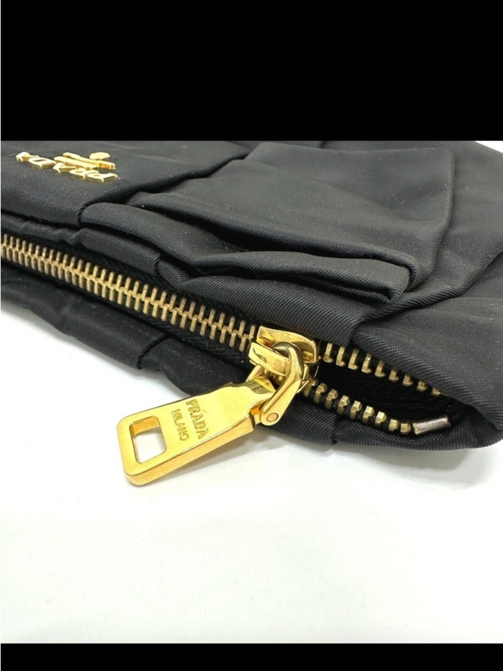 Prada Nylon Logo Ribbon Black Bow Wristlet with Gold Hardware
1N1422 - Picture 4 of 15